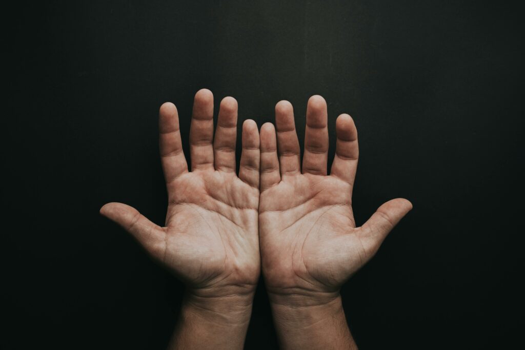 man holding his hands open