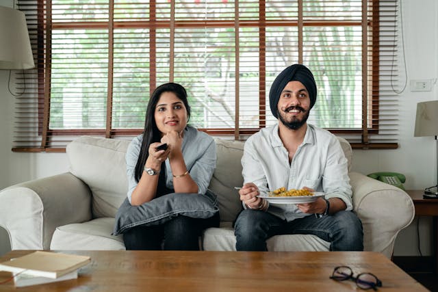a couple eating a tv dinner