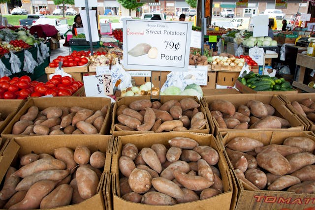 boxes of sweet potatoes in the market