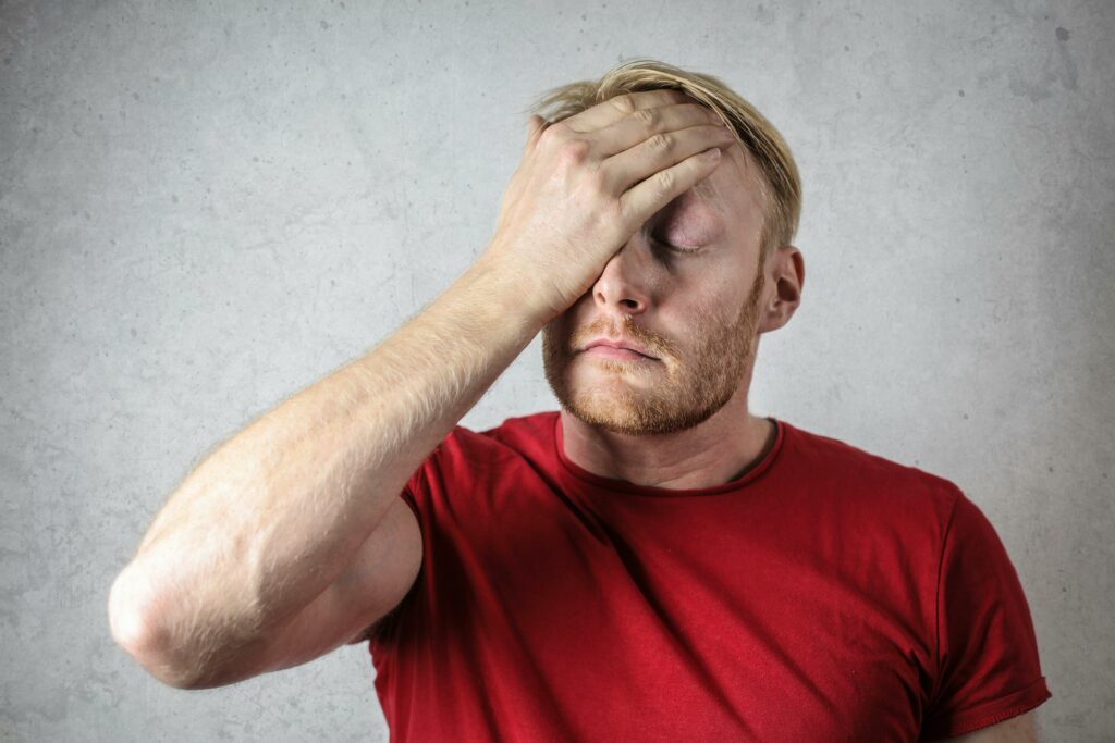 brain fog, man with hand on his face