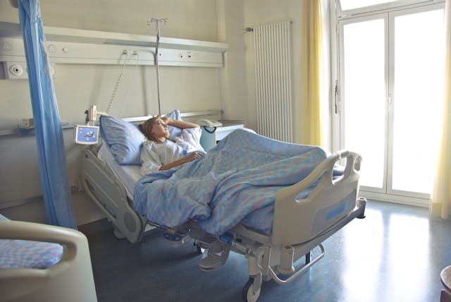woman lying in a hospital bed