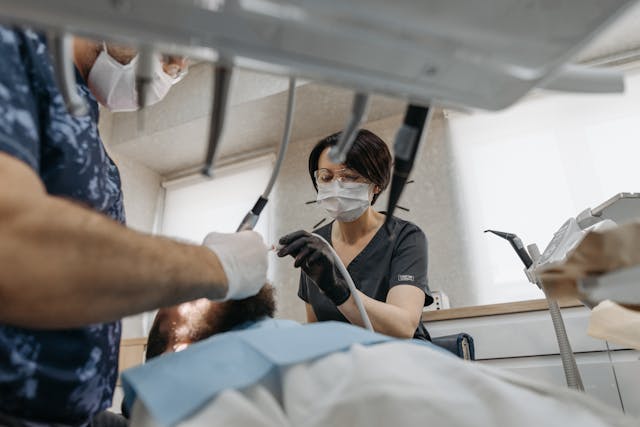 dentist working on mouth of patient
