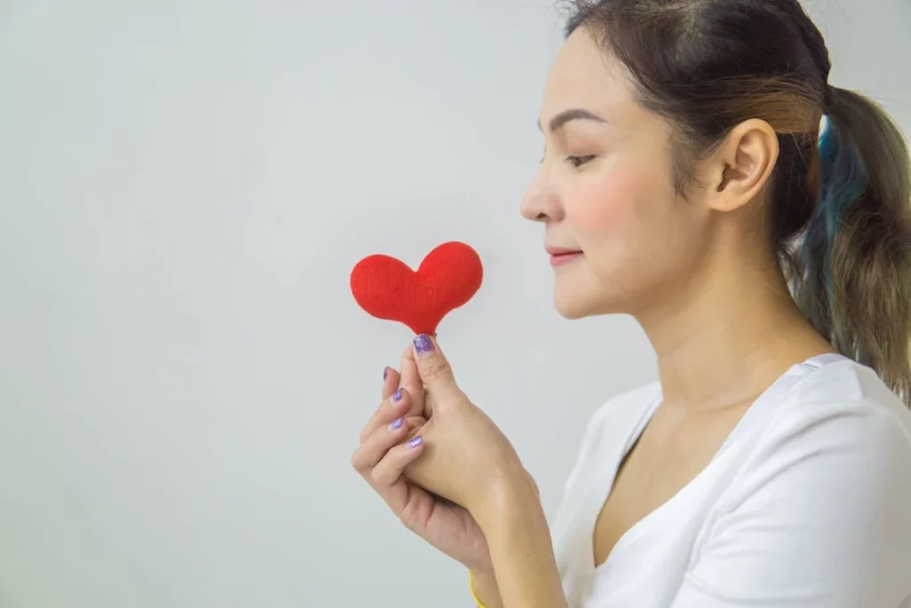 woman holding a heart