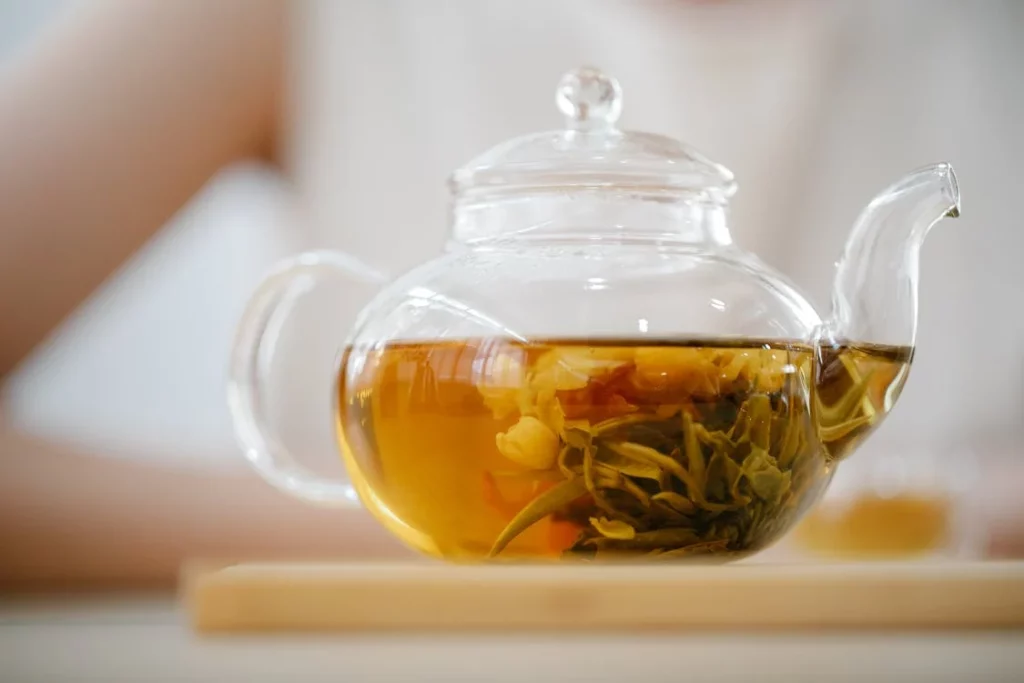tea in a clear glass teapot