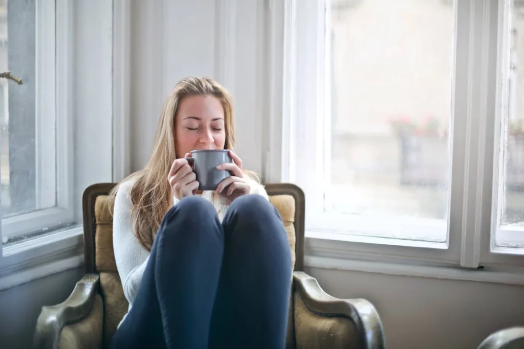 woman holding a cup