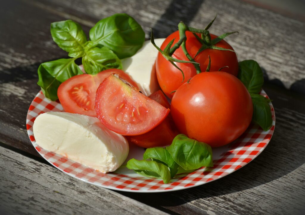 tomatoes on a plate with mozzarella