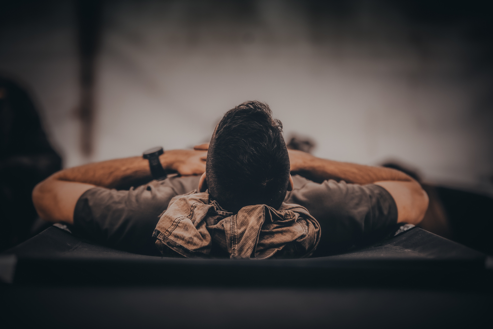 A closeup shot of a soldier sleeping in bed
