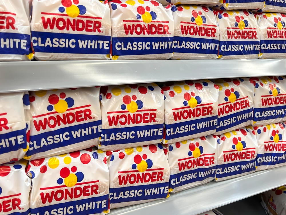 Orlando, Fl, USA - January 19, 2022: Wonder classic white Bread loaves on the shelf in a supermarket. Wonder Bread is a brand of bread which originated in the United States in 1921.
