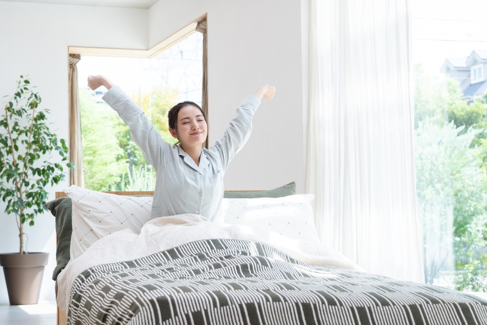 Young Asian woman waking up
