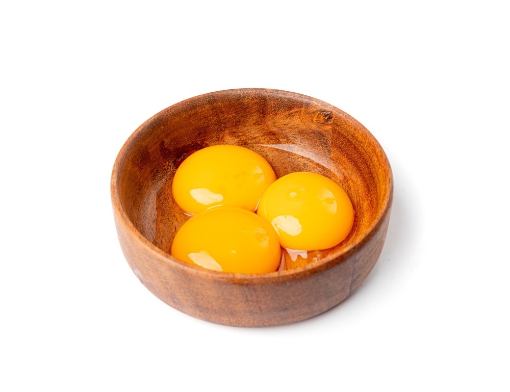 Egg Yolks in Bowl, 3 Fresh Chicken Egg Yolk Separated from Whites for Cooking Recipe, Three Organic Yolks in Wood Bowl