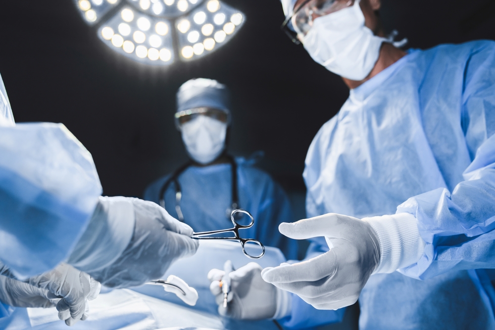 Close up of surgery team operating in modern hospital. Medical workers teamwork, saving rescuing patient`s life during plastic cardio surgery. Organs transplantation