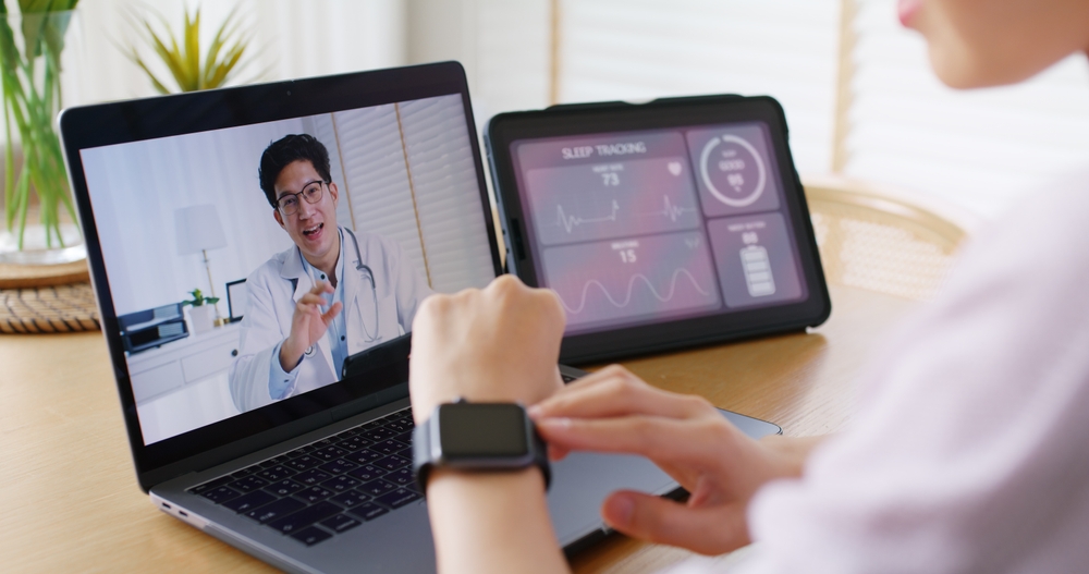 Asia people young woman video call talk chat help guide online at home by AI tele consult telehealth telemedicine app clinic in IoT device collect ECG data heart pulse sleep rate on cloud computing.
