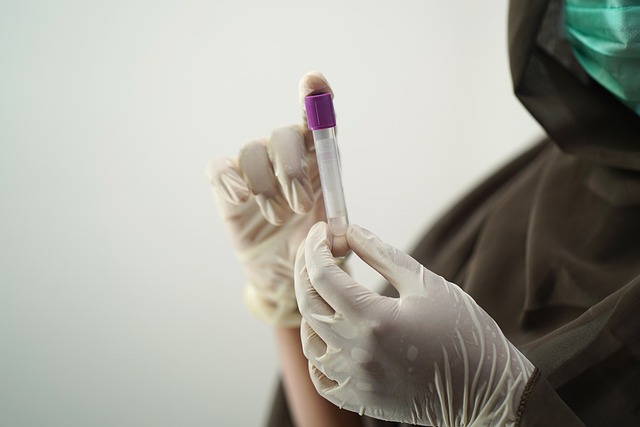 doctor holding vial sample