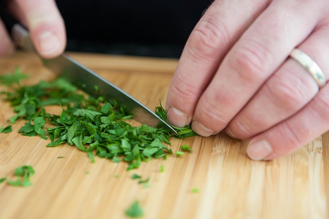 person cutting parsley
