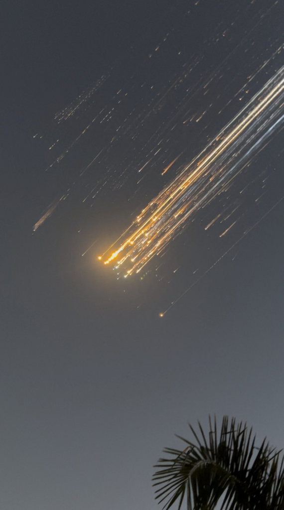 Orange balls of light fly across the sky as debris from a SpaceX rocket launched in Texas is spotted over Turks and Caicos 
