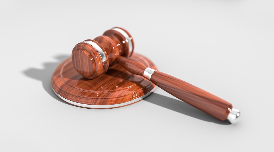 A wooden gavel on a white background, symbolizing legal authority and consumer rights awareness.