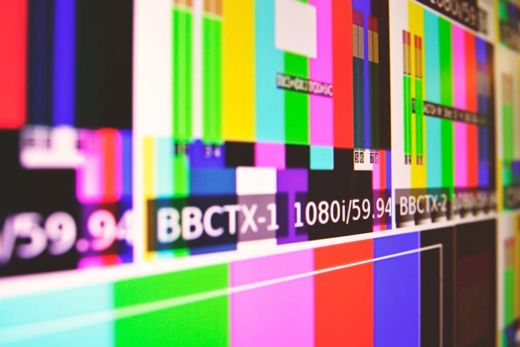 A television screen showcasing multiple colored bars, illustrating the idea that debt collectors are restricted from publicizing your business.