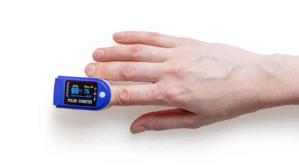 A person using a finger pulse oximeter, highlighting the importance of monitoring health for brain and heart well-being.