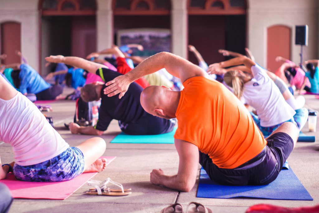 An individual engaging in beginner yoga, highlighting practical steps for health, including regular check-ups and gradual lifestyle changes.