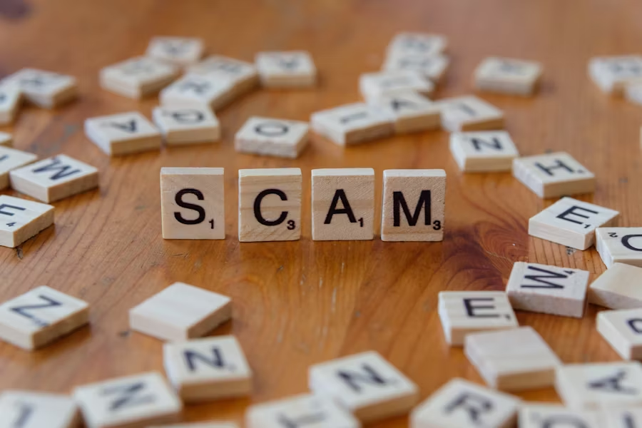 scrabble letters SCAM