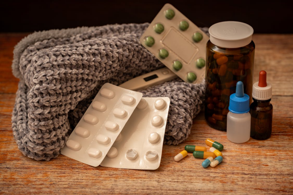 Cozy Home Remedy Setup with Medications and Scarf
