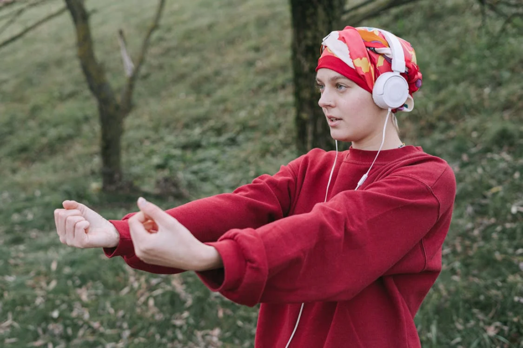 Woman Wearing White Headphones and Red Sweater