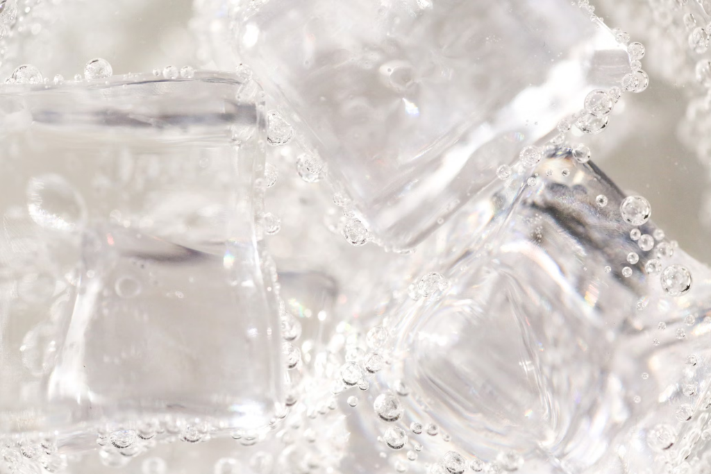 A close-up image of ice cubes with visible bubbles illustrates the carbonation found in many beverages, including soft drinks.