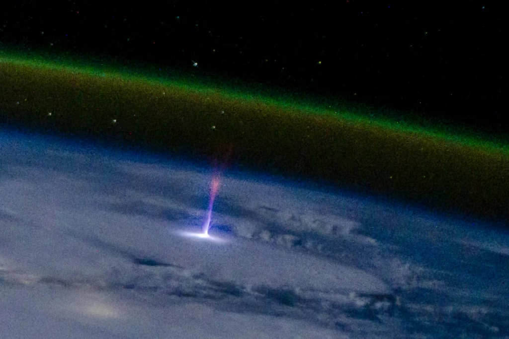 A blue jet-sprite photographed by crewmate Butch Wilmore from the International Space Station.