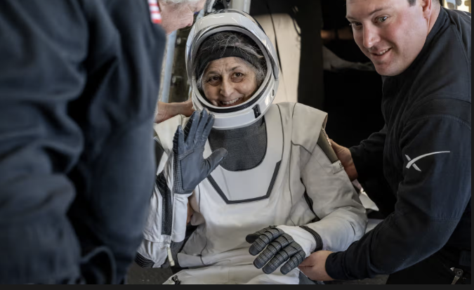 Astronaut Suni Williams waves after returning to Earth with three others onboard the SpaceX Dragon capsule.
