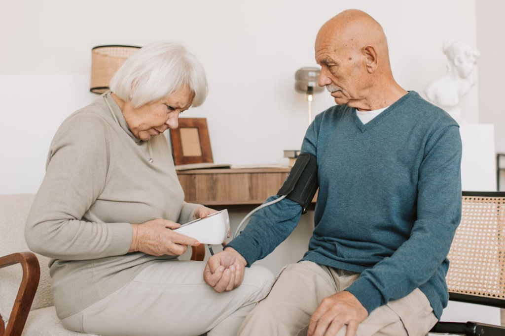 Woman Checking Blood Pressure of a Man