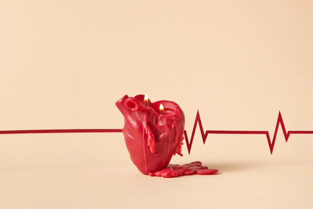 Photograph of a Lit Red Heart Candle