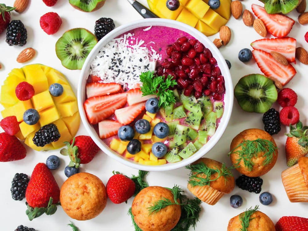 Assorted Sliced Fruits in White Ceramic Bow