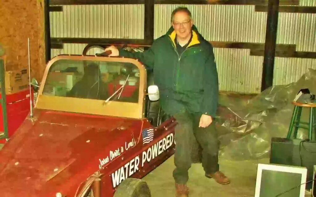 Stanley Meyer posing with his supposed 'water powered car.'