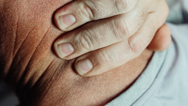 elderly man with neck pain