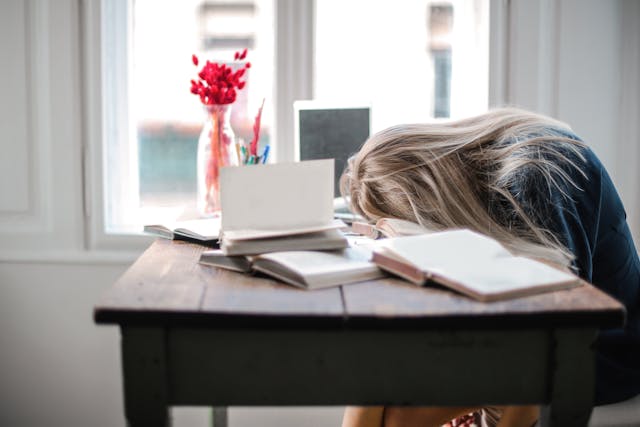 tired woman at desk