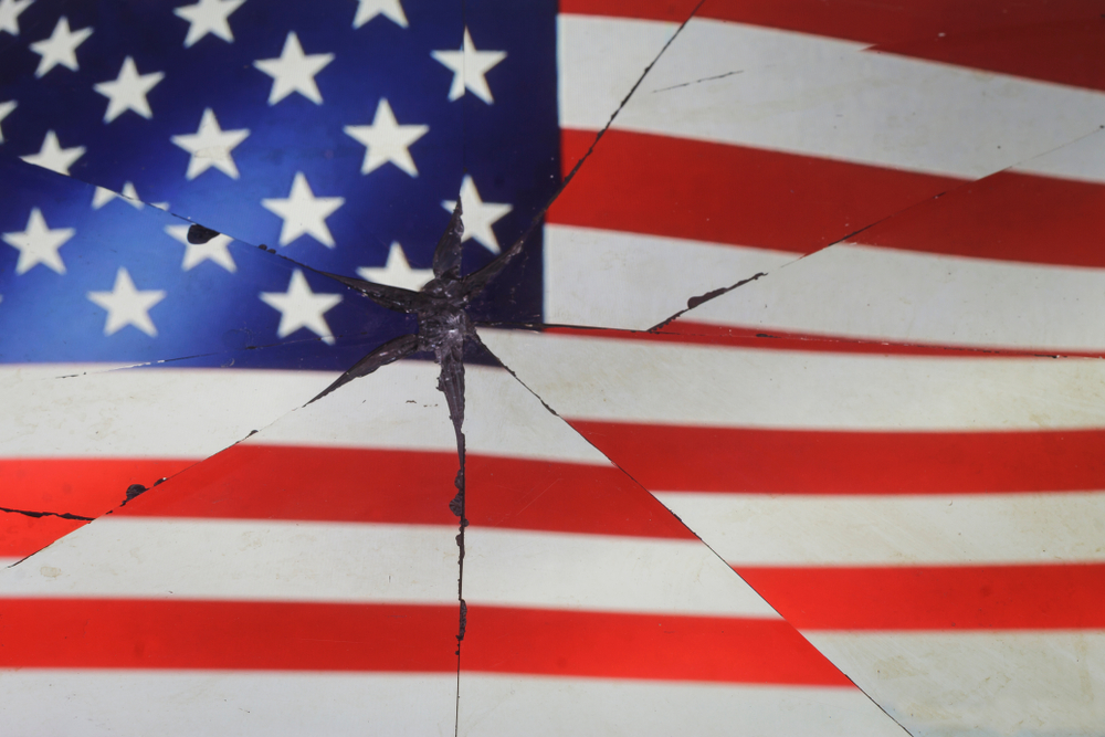 American flag is reflected in broken mirror