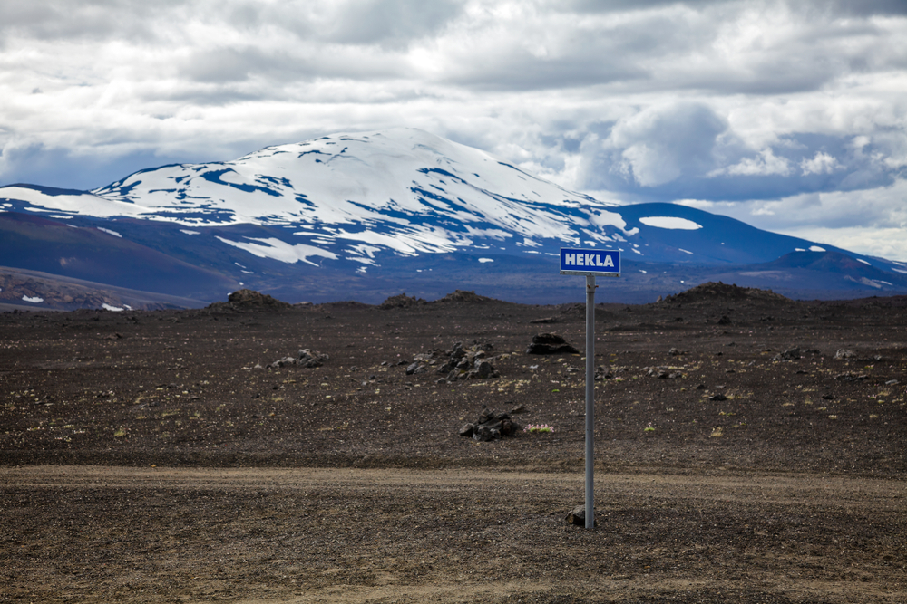 Hekla road sign with volcano in background. Hekla (Hecla) is one of Icelands most active volcanoes and a popular tourist attraction in Southwestern Iceland, Scandinavia