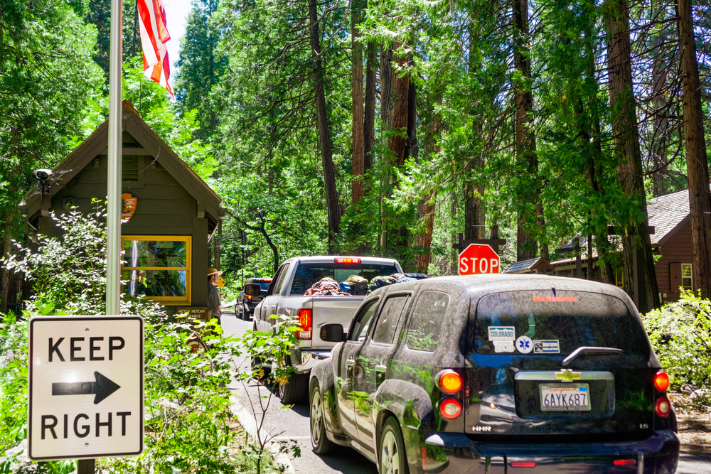 June 26, 2019 Yosemite National Park / CA / USA - Busy entrance station to Yosemite National Park, with cars waiting in line to obtain a permit