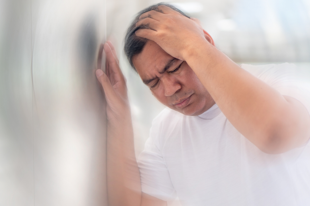 sick asian senior man suffering from vertigo headache; mental sickness concept for vertigo, dizziness, stress, depression, burnout, Alzheimer, brain cancer, Meniere disease, memory loss; old man model