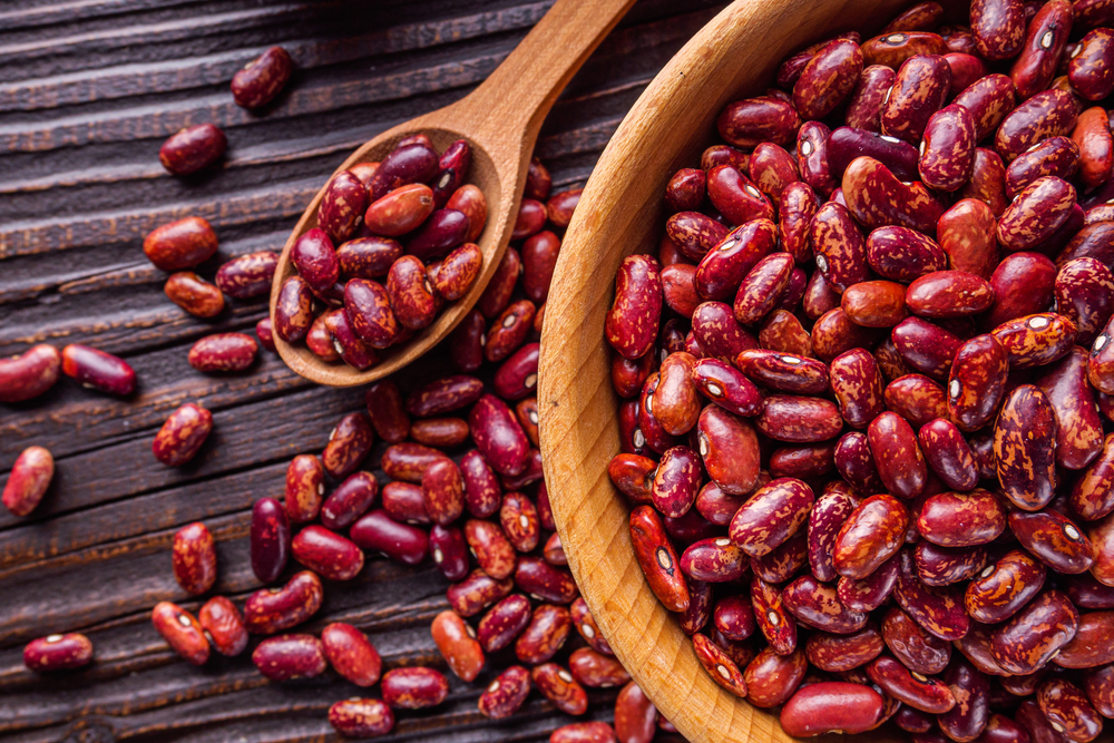 Fresh organic natural beans on wooden rustic background
