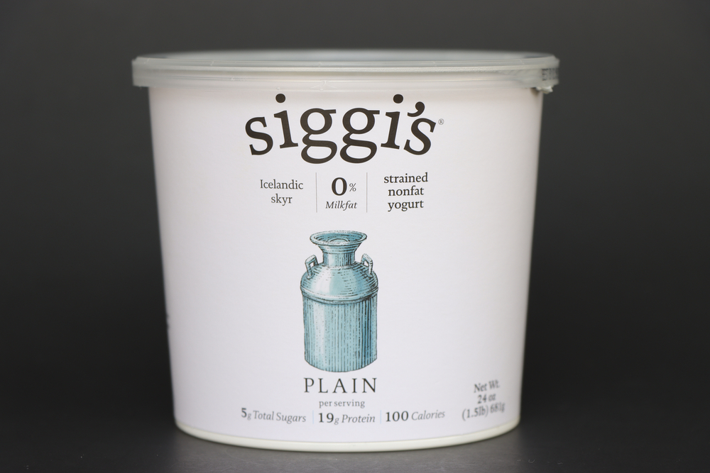 COLUMBUS, GEORGIA USA - 12-15-2020 Container of Siggi's plain yogurt against dark backdrop.