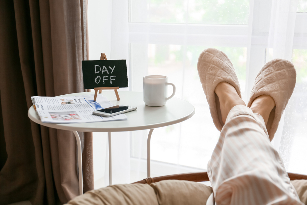 Woman in pajamas relaxing at home. Concept of day off
