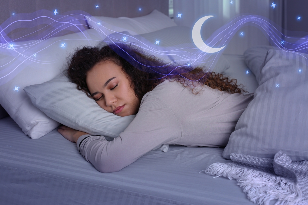 Young African American woman sleeping in bed, top view. Healthy circadian rhythm and sleep habits