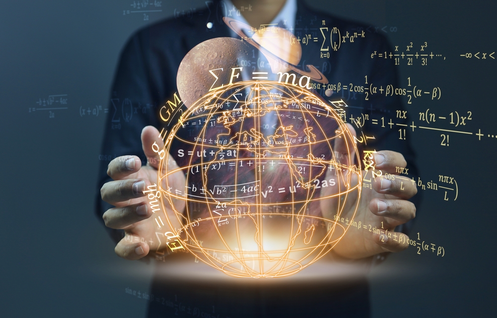 The globe floating among the hands of a scientist studying gravitational attraction between the planets in the solar system and equations hovering around him. Physic education concept.
