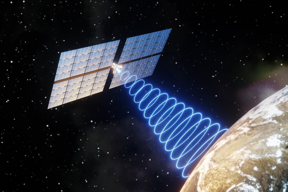 Satellite expanding its solar panels and emitting circular blue waves to the planet Earth. 3D illustration of the concept of space-based solar power station and space weapons