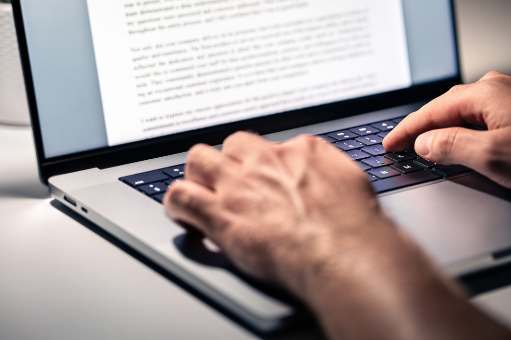 Writing text document, online content, book, letter or essay. Writer, journalist or freelance columnist with laptop. Resume, news article, report or college application. Freelancer, editor or employee
