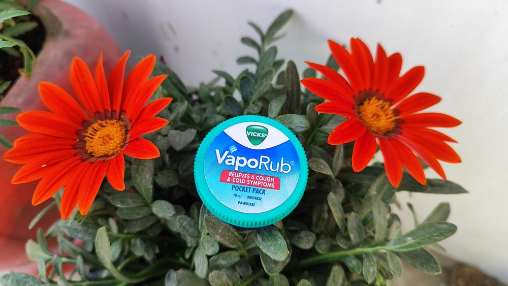 Uttar Pradesh, India February 14, 2024: Close up shot of vicks Vaporub. It's a topical cough over-the-counter medicine with powerful Vicks vapors. It works quickly to relieve coughs so you can breath.
