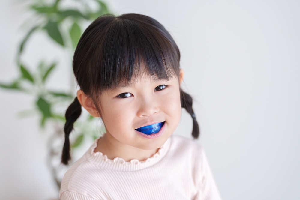 Child who wear braces with a mouthpiece