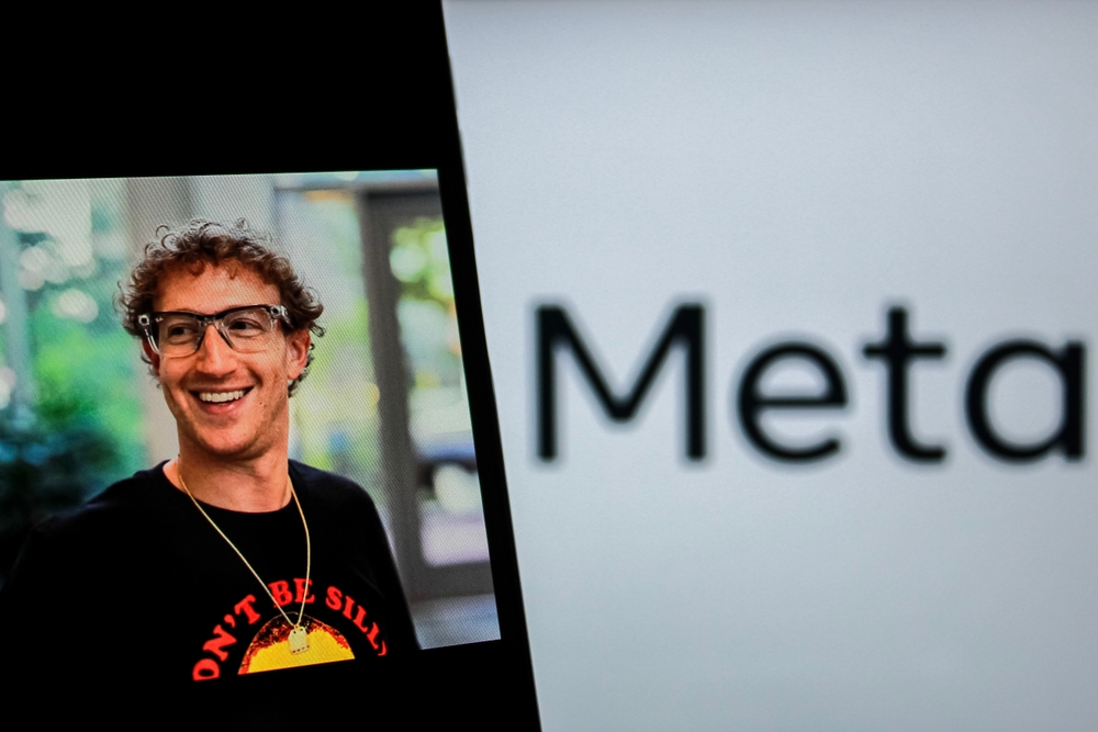 Bandung, Indonesia - Desember 22, 2024: In this photo illustration, a person is holding a mobile phone with MARK ZUCKERBERG facebook account with Meta Logo in the background.