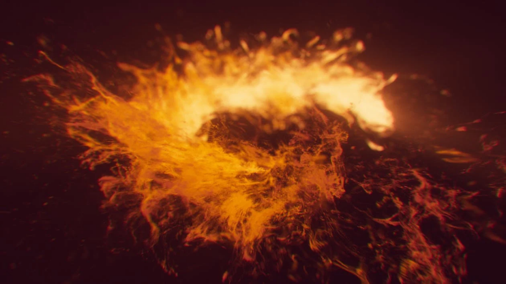 An abstract image of fire and flames, showing an explosion of bright orange and yellow light against a dark background. The fire creates a swirling, dynamic pattern that appears to be expanding outward.